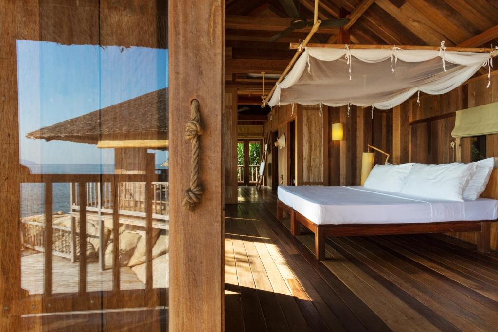 Nestled on a dramatic peninsula overlooking the serene Ninh Van Bay