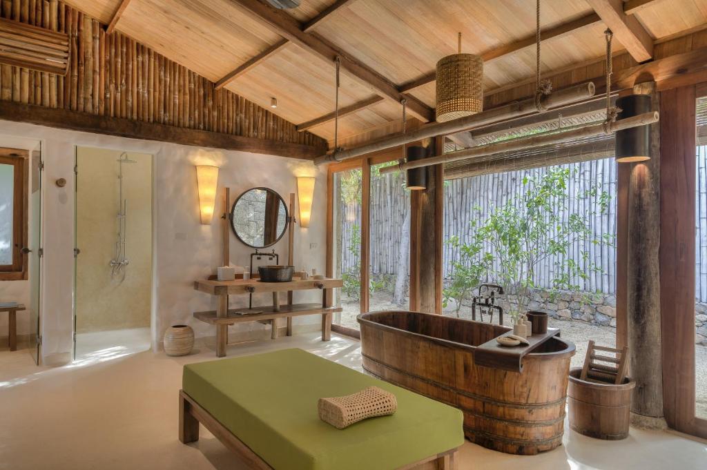 Nestled on a dramatic peninsula overlooking the serene Ninh Van Bay