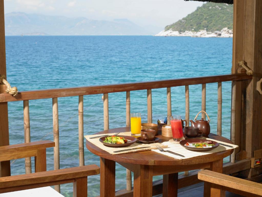 Nestled on a dramatic peninsula overlooking the serene Ninh Van Bay